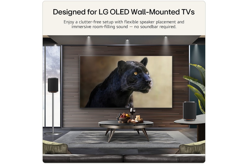 LG Stereo 5 wireless speakers positioned beside an LG OLED wall-mounted TV, delivering immersive room-filling audio in a modern living room.